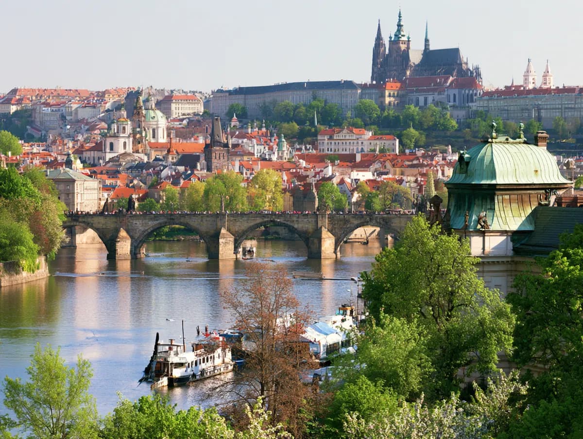 A river, bridge and castle skyline of a historic European city